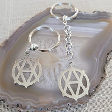 Load image into Gallery viewer, Vegan Anarchism Keychain, Backpack or Purse Charm, Zipper Pull, Stainless Steel Charm, Vegetarian Anarchist Key Ring