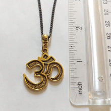 Load image into Gallery viewer, Ohm Aum Necklace - Brass Charm on Gunmetal Curb Chain - Reiki Zen Yoga Jewelry
